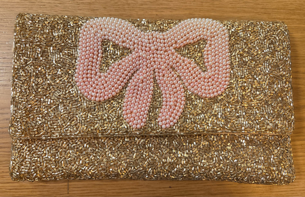 תיק קלאץ' פפיון זהב ורוד פואנטה